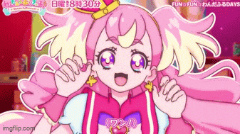 a cartoon girl with pink hair and blue eyes is making a face .