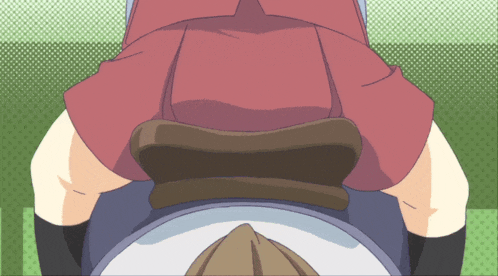 a woman in a red skirt is sitting on a man 's lap
