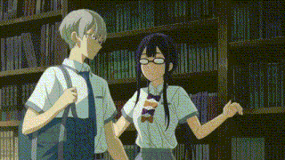 a boy and a girl are standing next to each other in a library holding hands .