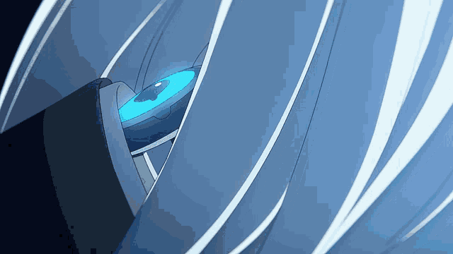 a close up of a blue object with a circle in the middle