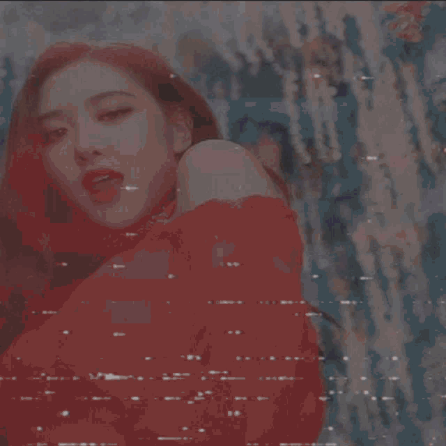 a girl in a plaid skirt is dancing on a stage