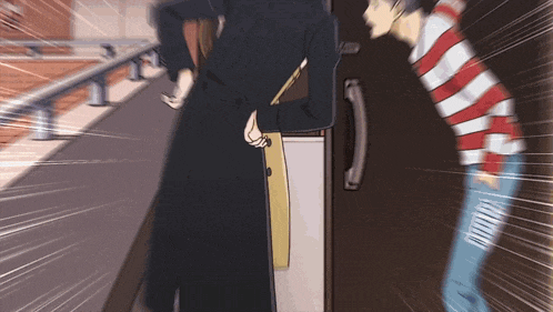 a man in a striped shirt is standing next to a woman in a long black coat