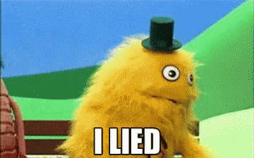 a yellow stuffed animal with a top hat and the words i lied below it