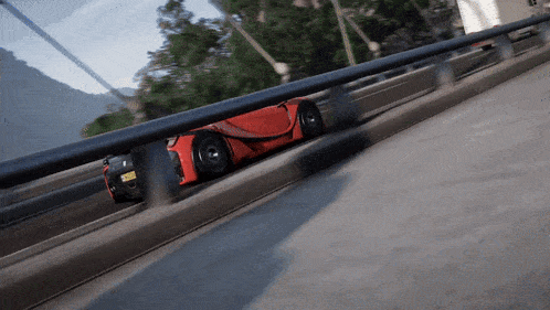 a red sports car with a license plate that says ' jcl ' on it