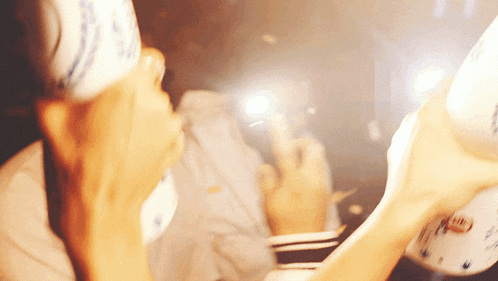 a blurred image of a person taking a picture with a cellphone