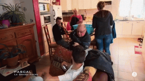 a group of people are gathered in a living room with the name pascal on the bottom right