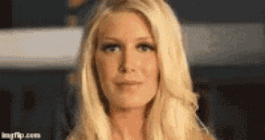 a close up of a woman 's face with blonde hair .