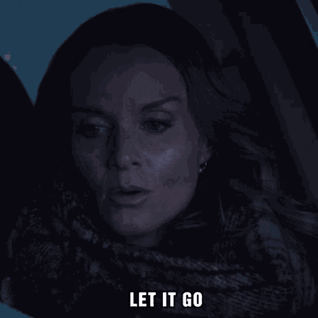 a woman in a car with the words let it go above her