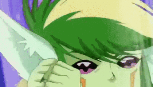 a close up of a person 's face with green hair and pink eyes