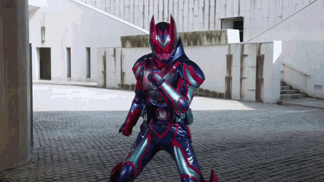 a man in a red and blue superhero costume is standing in front of a building