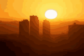 a sunset with a city in the foreground