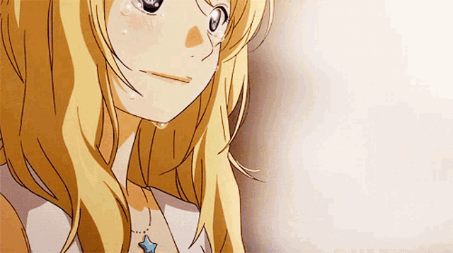 a close up of a blonde anime girl with a blue star necklace
