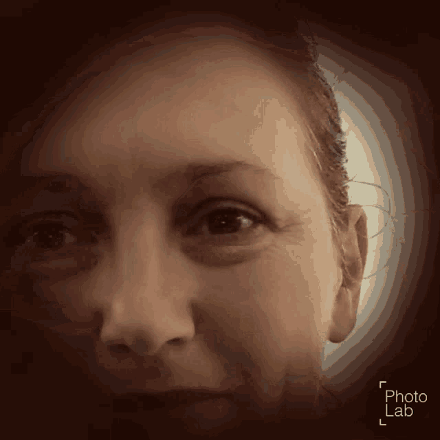 a close up of a woman 's face with the words photo lab below
