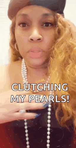 a woman wearing a hat and pearls says clutching my pearls