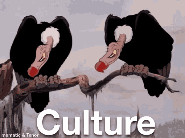 two vultures are perched on a tree branch with the word culture behind them