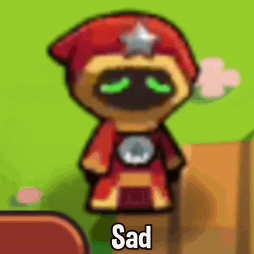 a cartoon character with green eyes is sitting on a wooden block with the word sad on it .