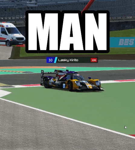 a race car is driving on a track with the word man behind it