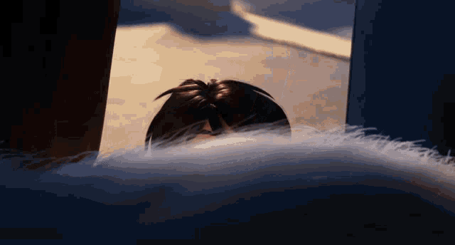 a close up of a person 's head with a furry blanket in the foreground