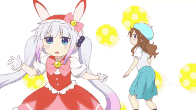a girl in a pink dress is standing next to a girl in a blue hat .