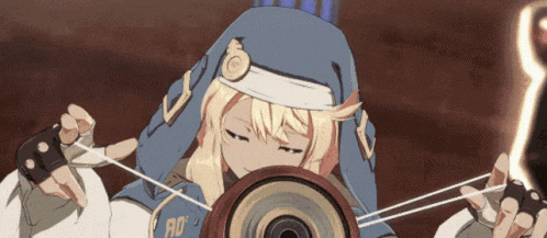 a girl in a blue hat with the letter r on it is holding a yo-yo