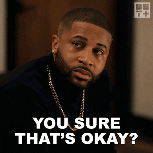 a man wearing a necklace says you sure that 's okay