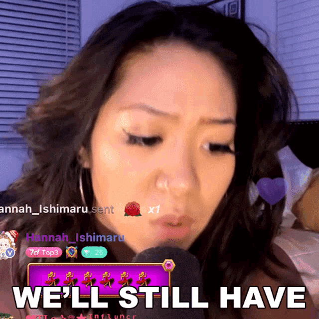 a woman speaking into a microphone with the words " we 'll still have " above her