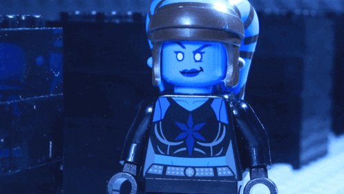 a blue lego figure holding a gun with a purple light