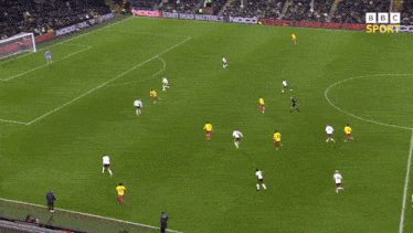 a soccer game is being played on a field sponsored by noco