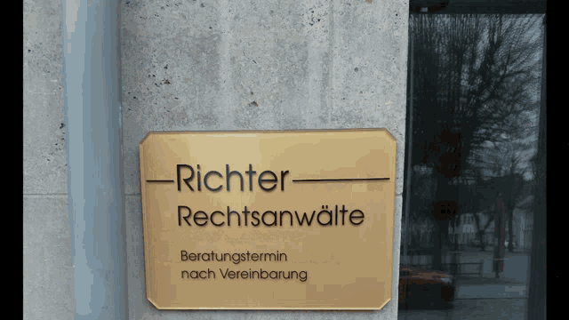 a sign on the side of a building that says richter rechtsanwälte