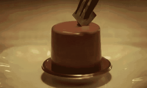 a chocolate cake with a fork sticking out of it