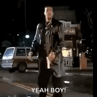 a man in a trench coat is standing on the side of a street with his arms outstretched .