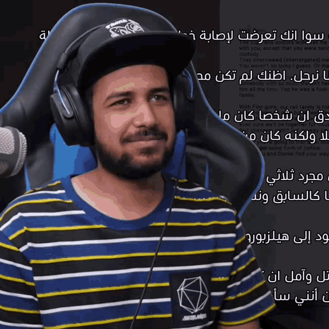 a man wearing headphones and a hat that says thank you for playing