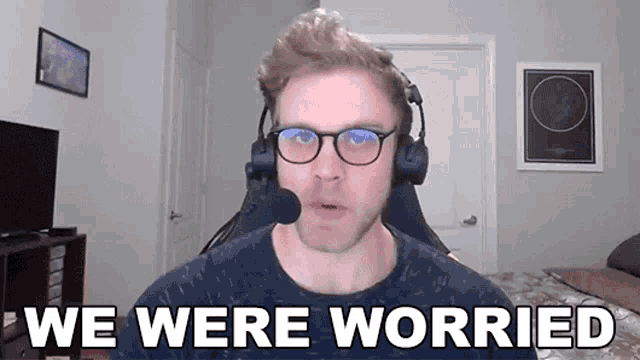 a man wearing headphones and glasses says " we were worried "