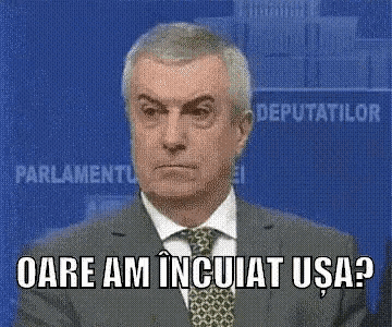 a man in a suit and tie says oare am incujat usa