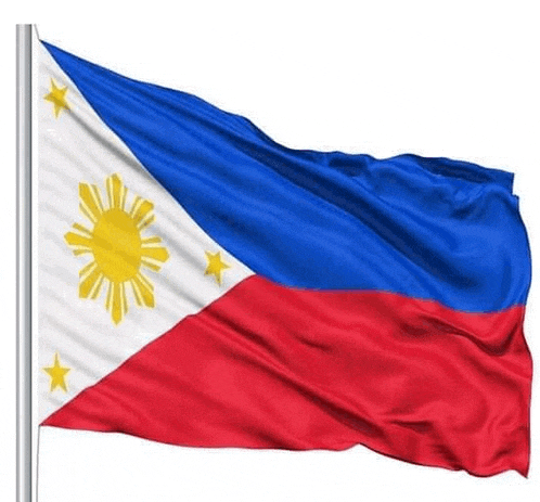 the flag of the philippines is flying in the wind on a pole .