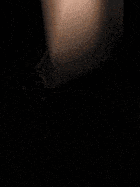 a close up of a person 's arm with a blurred background