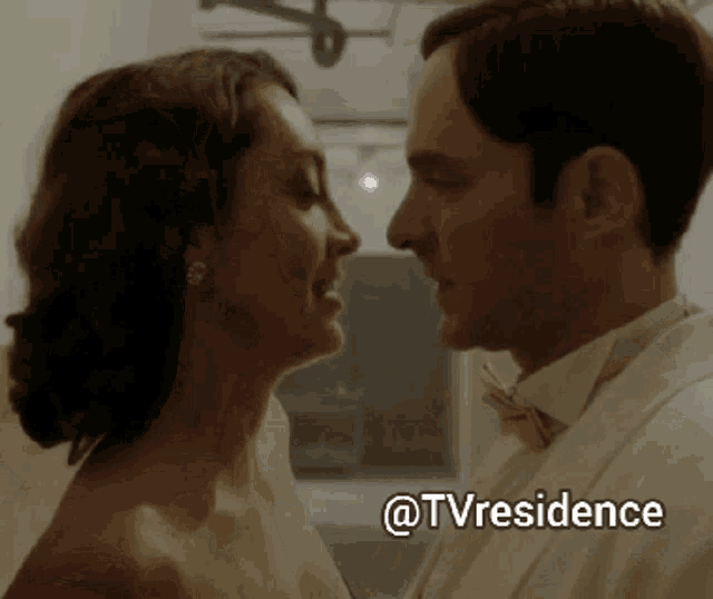 a man in a tuxedo and a woman in a wedding dress are kissing with the caption @tvresidence