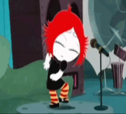 a little girl with red hair is singing into a microphone .