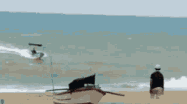 a blurred image of a boat on the beach