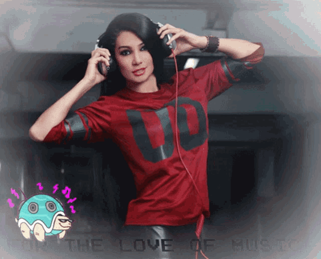 a woman wearing headphones and a red shirt that says ' uo ' on it