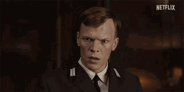 a man in a military uniform with a netflix logo in the background