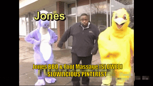 a man in a purple dinosaur costume stands next to a yellow chicken mascot