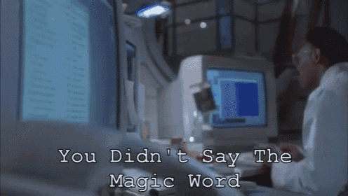 a man sitting in front of a computer with the words you didn 't say the magic word