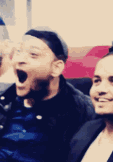 a blurry picture of a man with his mouth wide open