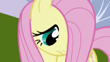 a close up of a cartoon pony with pink hair and blue eyes