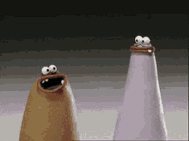 two cartoon characters are standing next to each other with big eyes