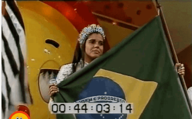 a woman in a crown holds a brazilian flag in front of a yellow smiley face
