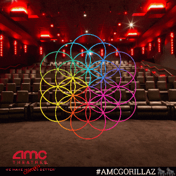 an advertisement for amc theatres shows an empty auditorium with a colorful flower in the middle