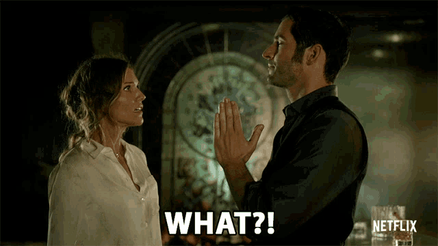 a man and a woman are looking at each other and the man is saying " what "