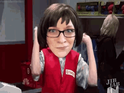 a woman wearing glasses and a red vest is flexing her muscles in a target store .